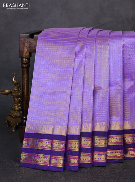 Silk cotton saree lavender and blue with allover small zari ckecked pattern and temple rettapet zari woven korvai border