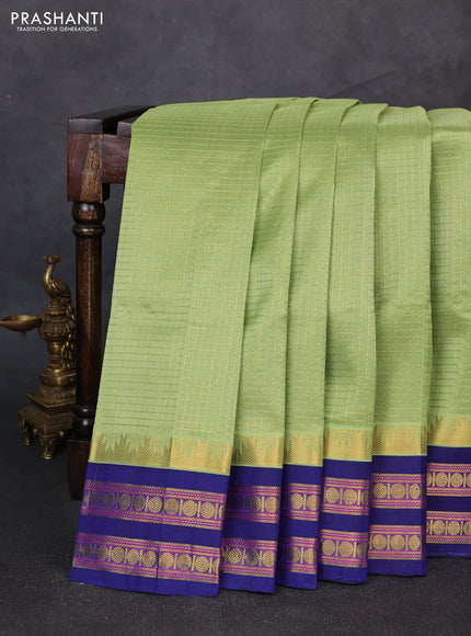 Silk cotton saree pista green and blue with allover small zari ckecked pattern and temple rettapet zari woven korvai border
