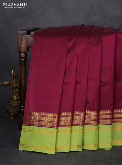 Silk cotton saree deep wine shade and light green with plain body and temple rettapet zari woven korvai border