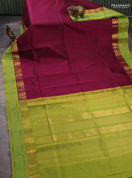 Silk cotton saree deep wine shade and light green with plain body and temple rettapet zari woven korvai border