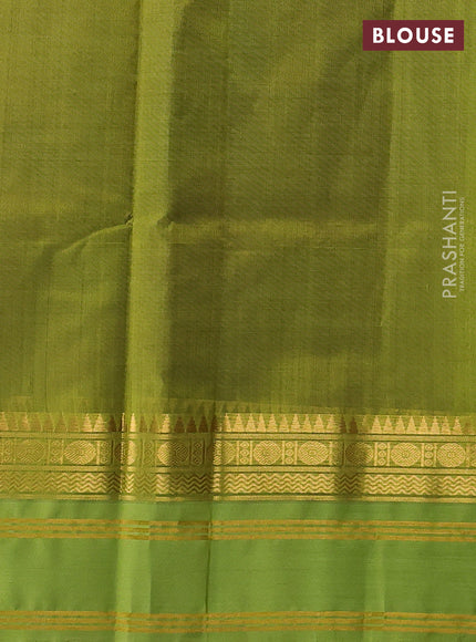 Silk cotton saree deep wine shade and light green with plain body and temple rettapet zari woven korvai border