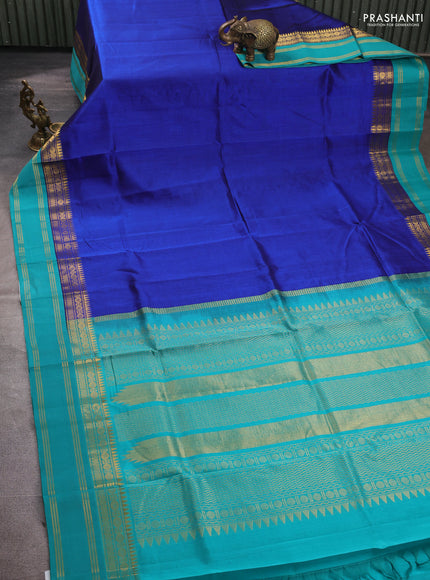 Silk cotton saree blue and teal green with plain body and temple rettapet zari woven korvai border