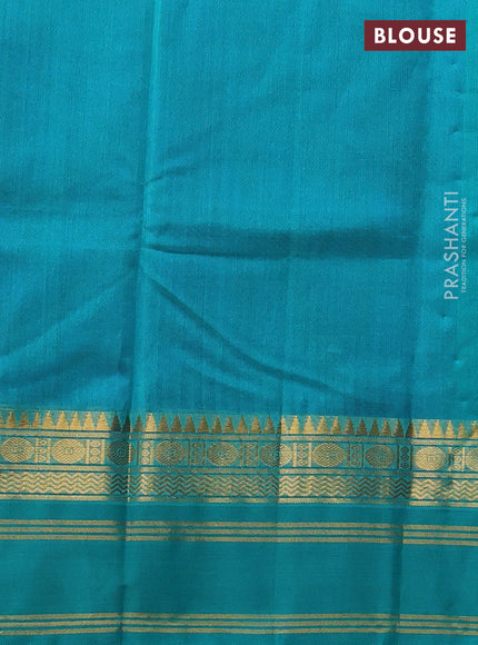 Silk cotton saree blue and teal green with plain body and temple rettapet zari woven korvai border