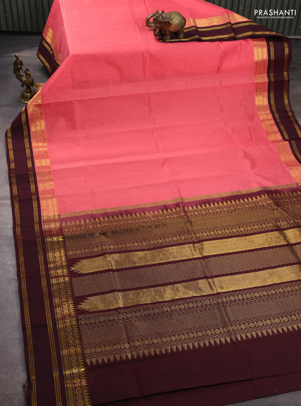 Silk cotton saree peach pink and coffee brown with plain body and temple rettapet zari woven korvai border