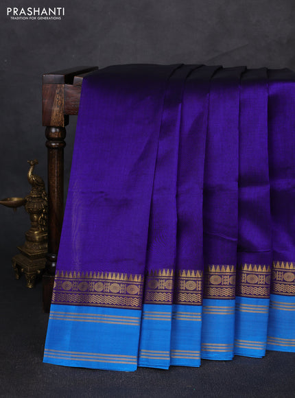 Silk cotton saree violet and cs blue with plain body and temple rettapet zari woven korvai border