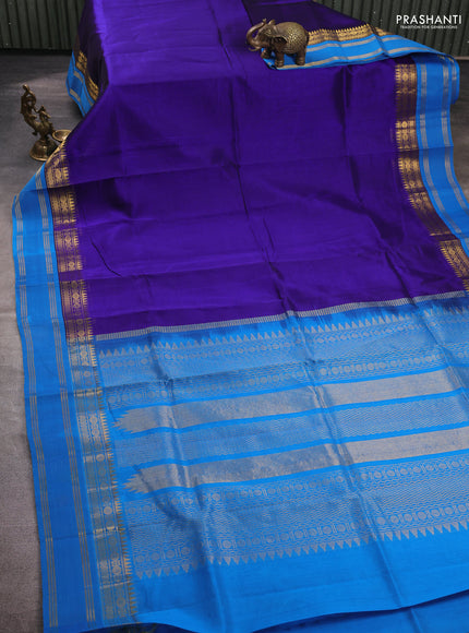 Silk cotton saree violet and cs blue with plain body and temple rettapet zari woven korvai border