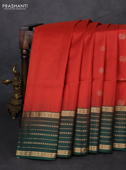 Pure soft silk saree rust shade and bottle green with allover zari woven buttas and zari woven border