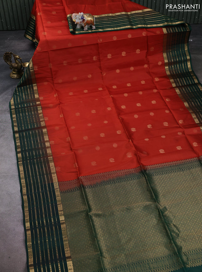Pure soft silk saree rust shade and bottle green with allover zari woven buttas and zari woven border