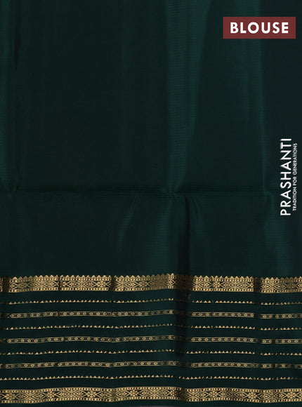 Pure soft silk saree rust shade and bottle green with allover zari woven buttas and zari woven border