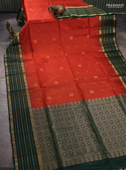 Pure soft silk saree rust shade and bottle green with allover zari woven buttas and zari woven border