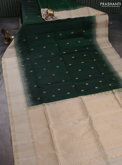 Pure soft silk saree bottle green and beige with allover zari woven buttas and rettapet zari woven border