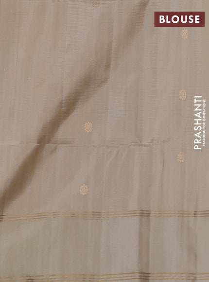 Pure soft silk saree bottle green and beige with allover zari woven buttas and rettapet zari woven border