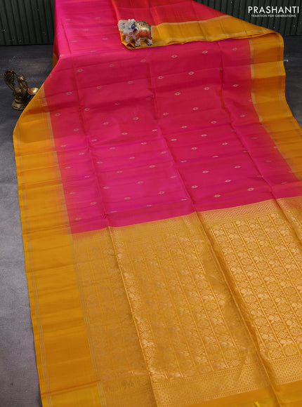 Pure soft silk saree dual shade of pinkish orange and mustard yellow with allover zari woven buttas and rettapet zari woven border