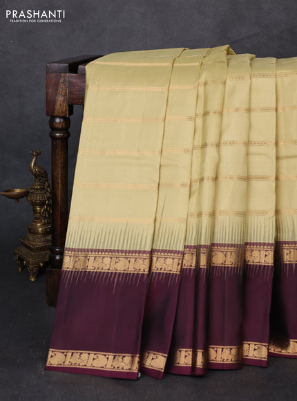 Pure soft silk saree mild pista green and deep wine with allover zari weaves pattern and long rettapet zari woven border