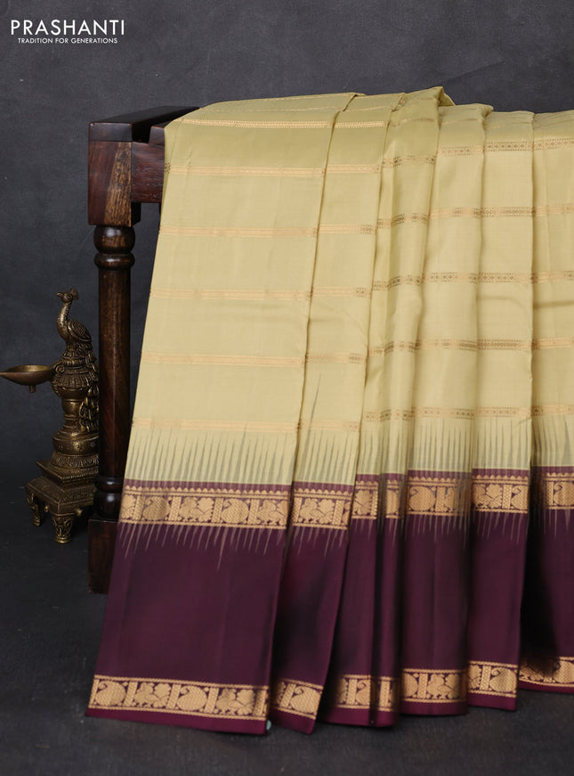 Pure soft silk saree mild pista green and deep wine with allover zari weaves pattern and long rettapet zari woven border