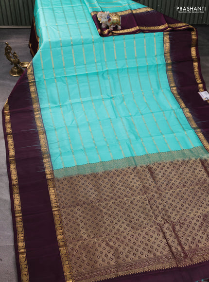 Pure soft silk saree teal blue and deep wine with allover zari weaves pattern and long rettapet zari woven border