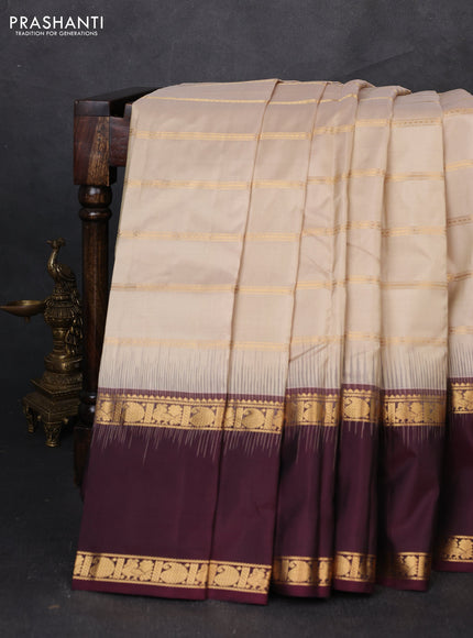 Pure soft silk saree beige and deep wine with allover zari weaves pattern and long rettapet zari woven border