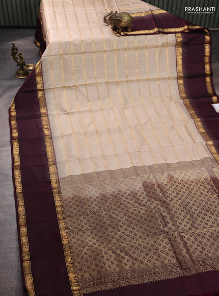 Pure soft silk saree beige and deep wine with allover zari weaves pattern and long rettapet zari woven border