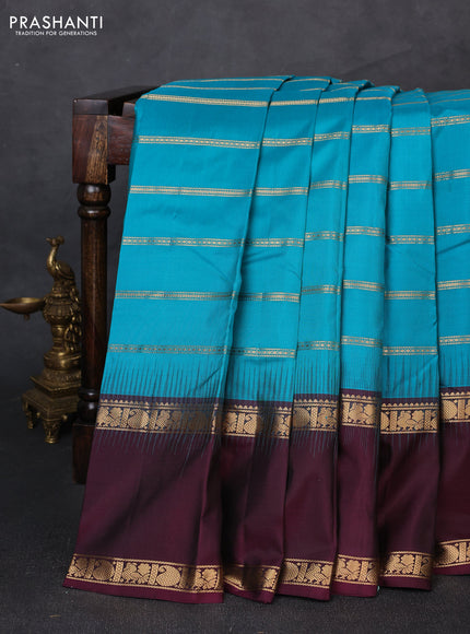 Pure soft silk saree teal blue and deep wine with allover zari weaves pattern and long rettapet zari woven border