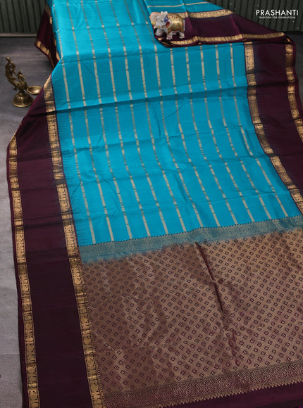 Pure soft silk saree teal blue and deep wine with allover zari weaves pattern and long rettapet zari woven border