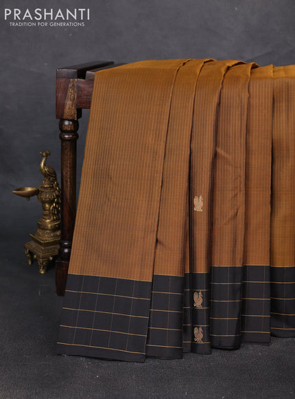 Pure soft silk saree dark mustard and black with allover zari weaves and silver zari woven checked border