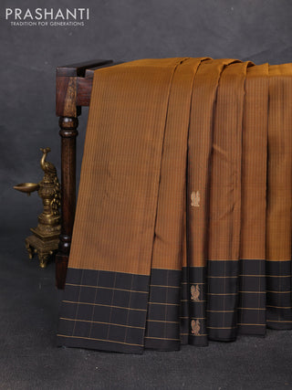 Pure soft silk saree dark mustard and black with allover zari weaves and silver zari woven checked border