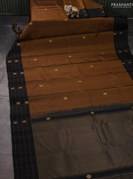 Pure soft silk saree dark mustard and black with allover zari weaves and silver zari woven checked border
