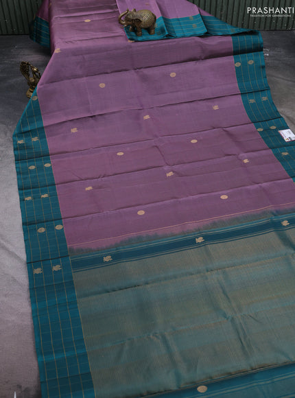Pure soft silk saree pastel purple and teal green with allover zari weaves and silver zari woven checked border