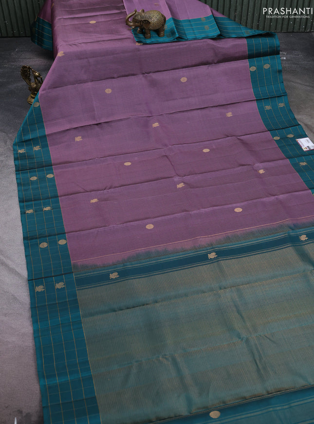 Pure soft silk saree pastel purple and teal green with allover zari weaves and silver zari woven checked border