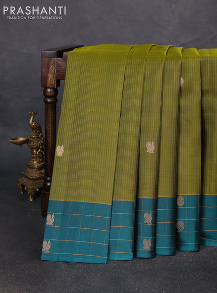 Pure soft silk saree mehendi green and peacock green with allover zari weaves and zari woven checked border