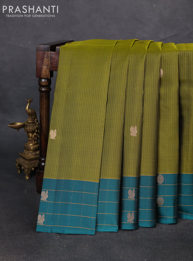 Pure soft silk saree mehendi green and peacock green with allover zari weaves and zari woven checked border