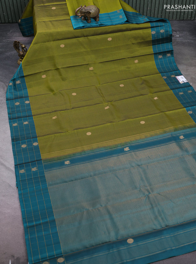 Pure soft silk saree mehendi green and peacock green with allover zari weaves and zari woven checked border