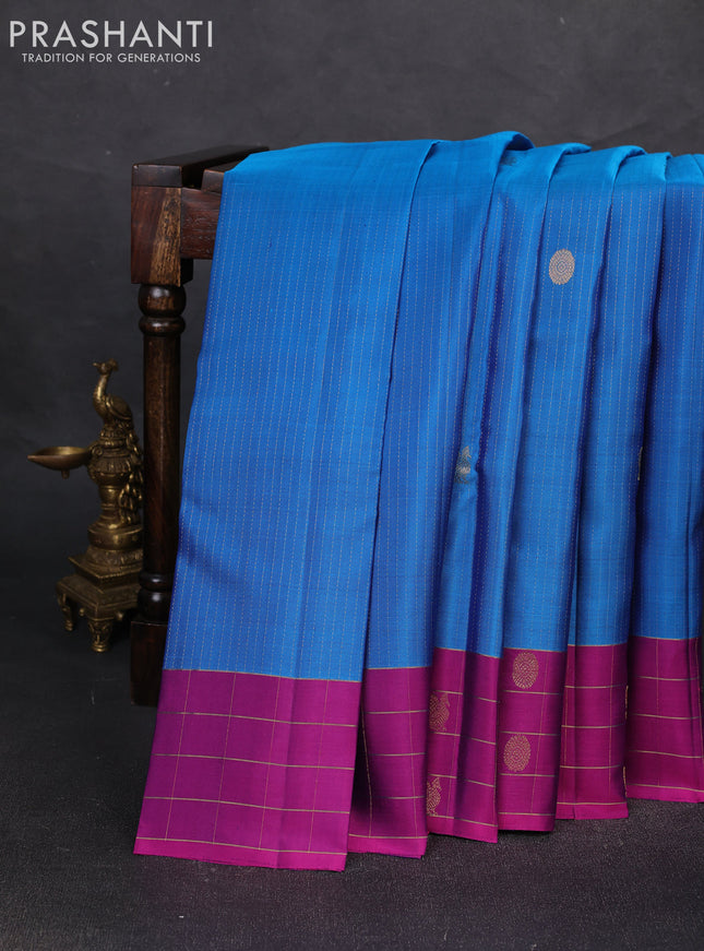 Pure soft silk saree cs blue and purple with allover zari weaves and zari woven checked border