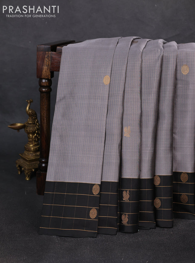 Pure soft silk saree grey and black with allover zari weaves and zari woven checked border