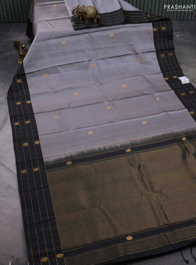 Pure soft silk saree grey and black with allover zari weaves and zari woven checked border