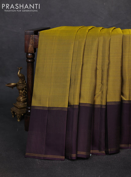 Pure soft silk saree mustard green and wine shade with allover zari weaves and zari woven checked border