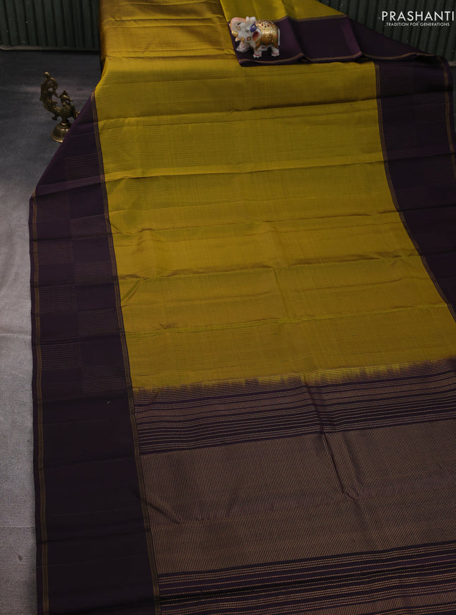Pure soft silk saree mustard green and wine shade with allover zari weaves and zari woven checked border