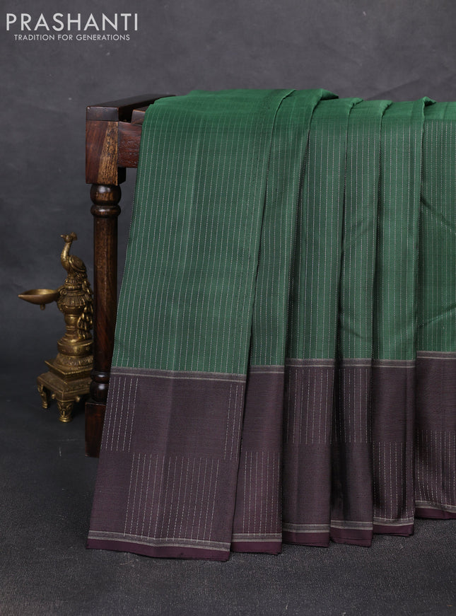 Pure soft silk saree bottle green and wine shade with allover zari weaves and zari woven checked border