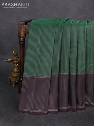 Pure soft silk saree bottle green and wine shade with allover zari weaves and zari woven checked border
