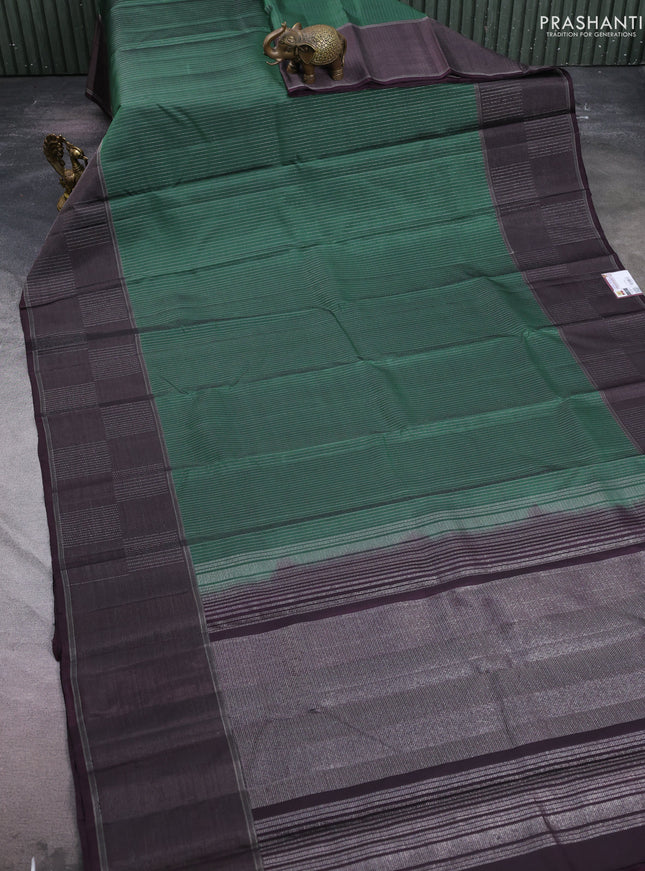 Pure soft silk saree bottle green and wine shade with allover zari weaves and zari woven checked border