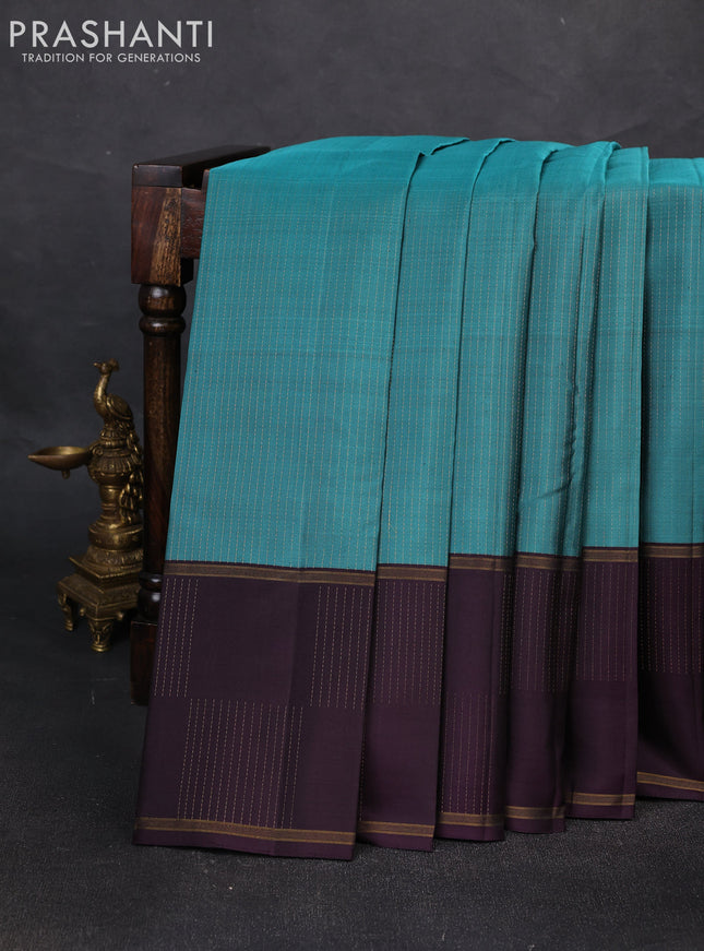 Pure soft silk saree teal blue shade and wine shade with allover zari weaves and zari woven checked border