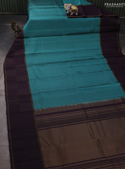 Pure soft silk saree teal blue shade and wine shade with allover zari weaves and zari woven checked border