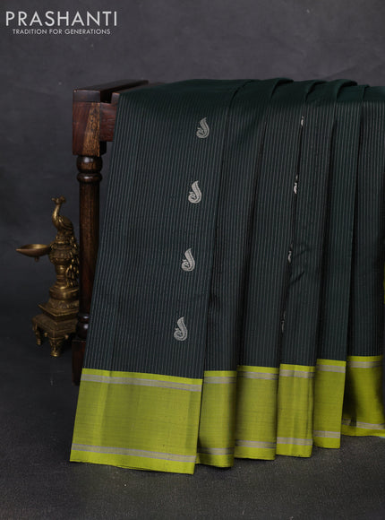 Pure soft silk saree bottle green and mehendi green with allover silver zari weaves and rettapet zari woven border
