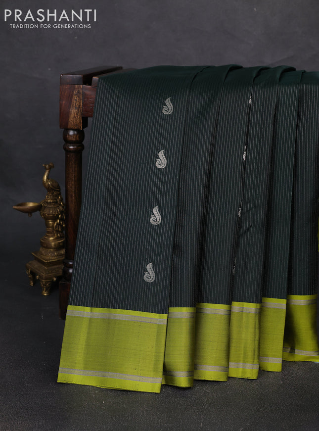 Pure soft silk saree bottle green and mehendi green with allover silver zari weaves and rettapet zari woven border