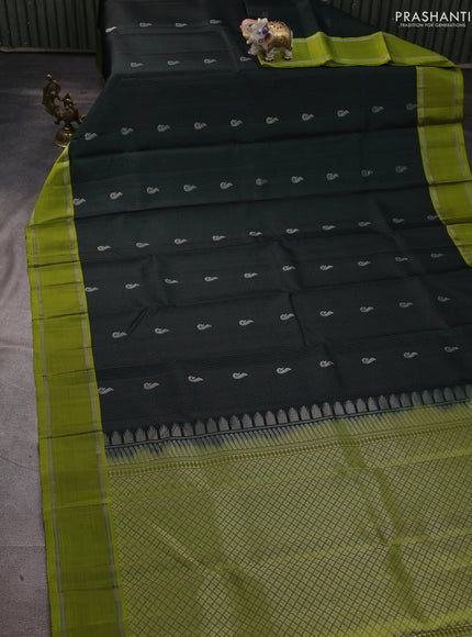 Pure soft silk saree bottle green and mehendi green with allover silver zari weaves and rettapet zari woven border