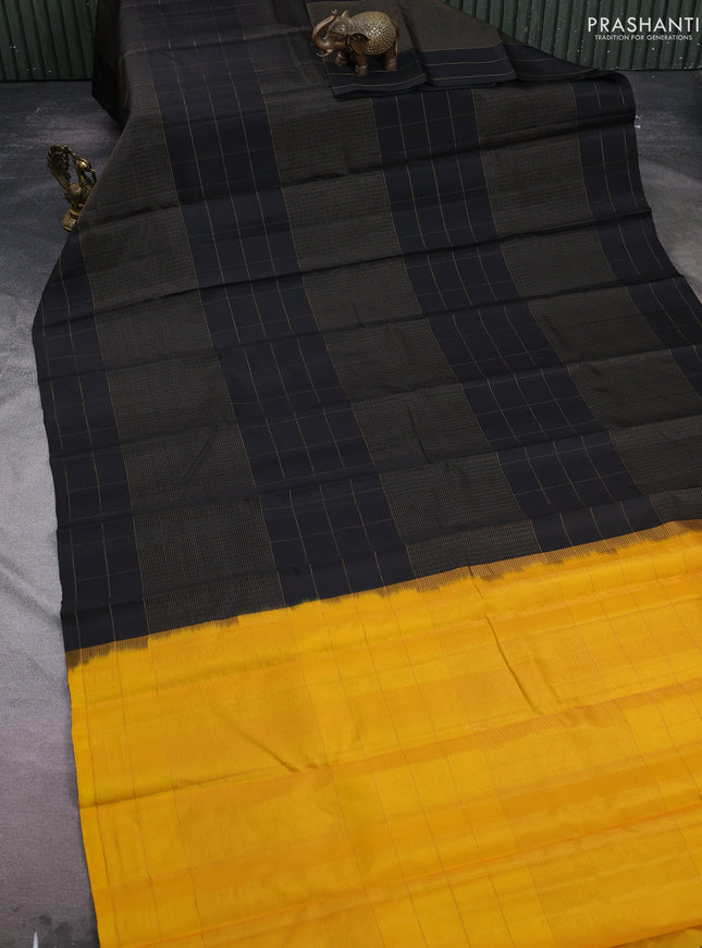 Pure soft silk saree black and yellow with allover zari woven small checked pattern and zari woven checked border