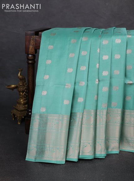 Pure soft silk saree mild teal green with allover zari woven buttas and long zari woven border