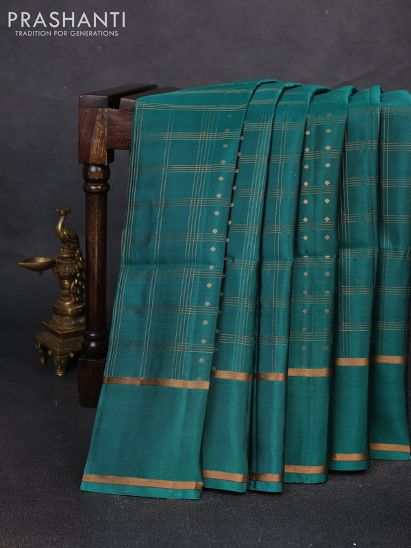 Pure soft silk saree teal green with allover zari checks & buttas and rettapet zari woven border