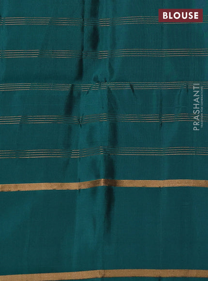 Pure soft silk saree teal green with allover zari checks & buttas and rettapet zari woven border