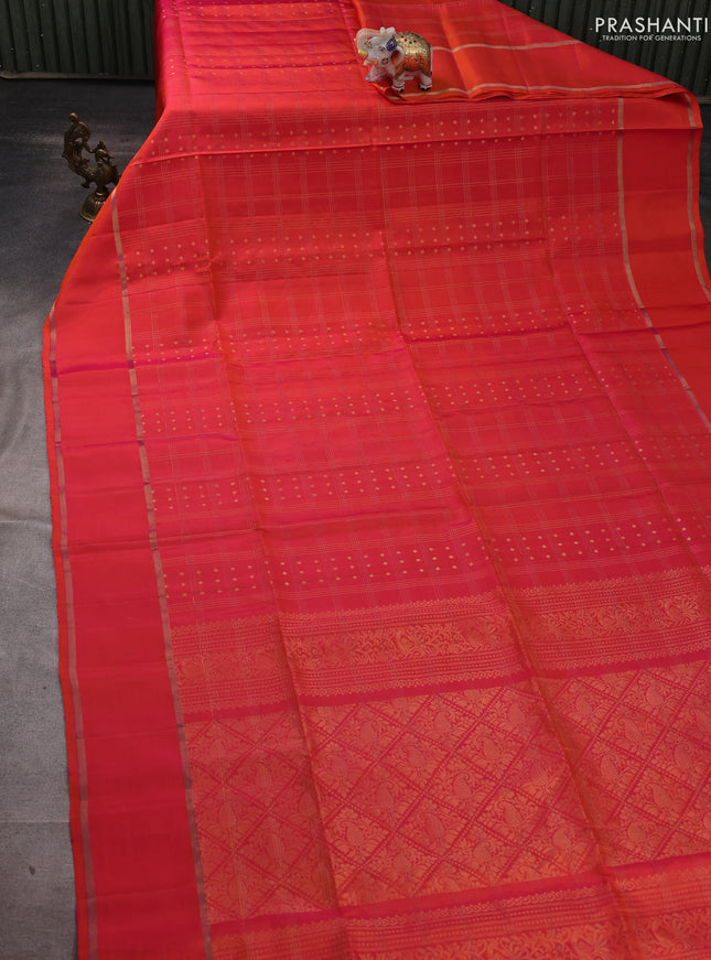 Pure soft silk saree dual shade of pinkish orange with allover zari checks & buttas and rettapet zari woven border